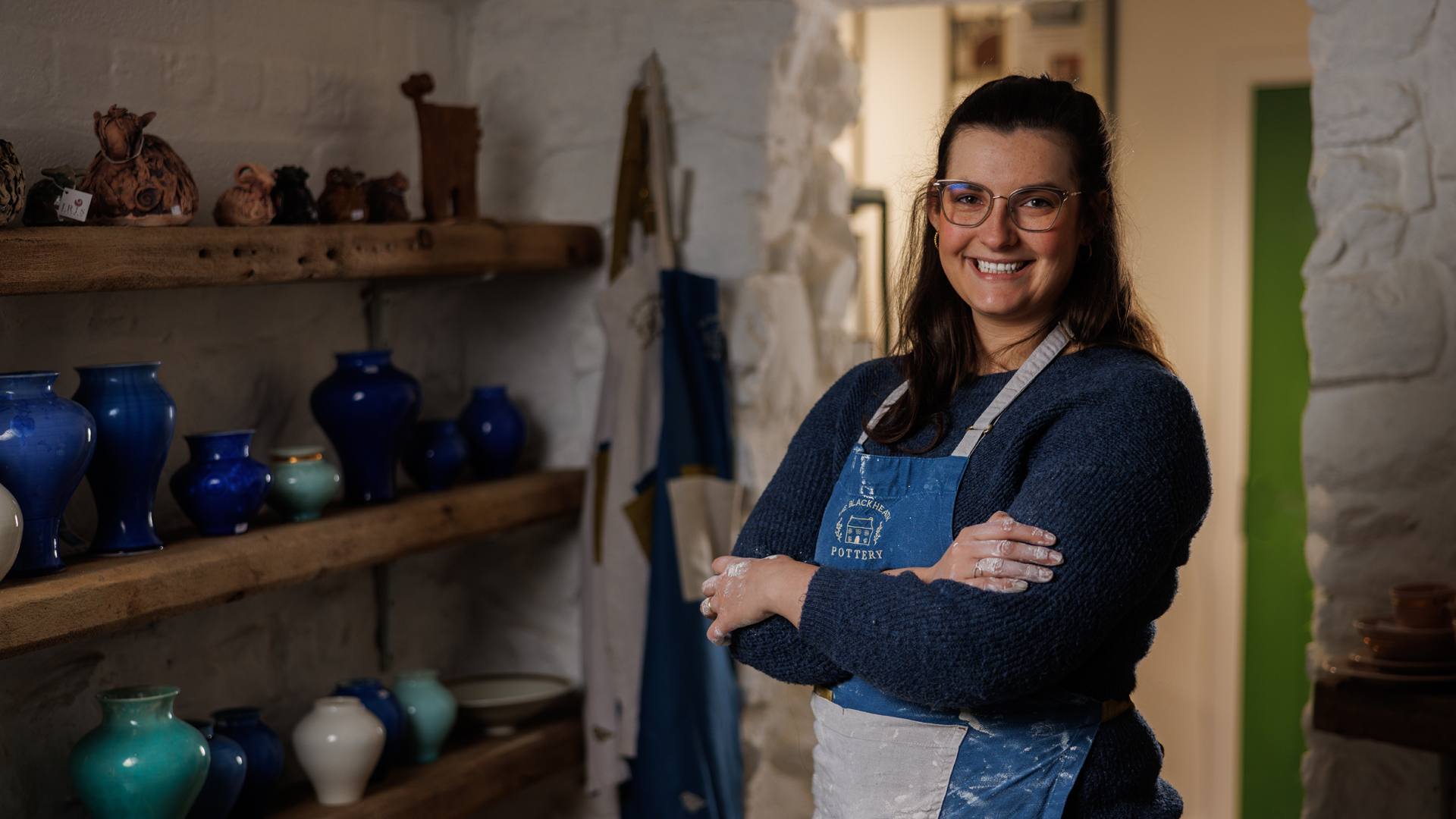 Potter Babs Belshaw of Blackheath Pottery, standing in her studio.